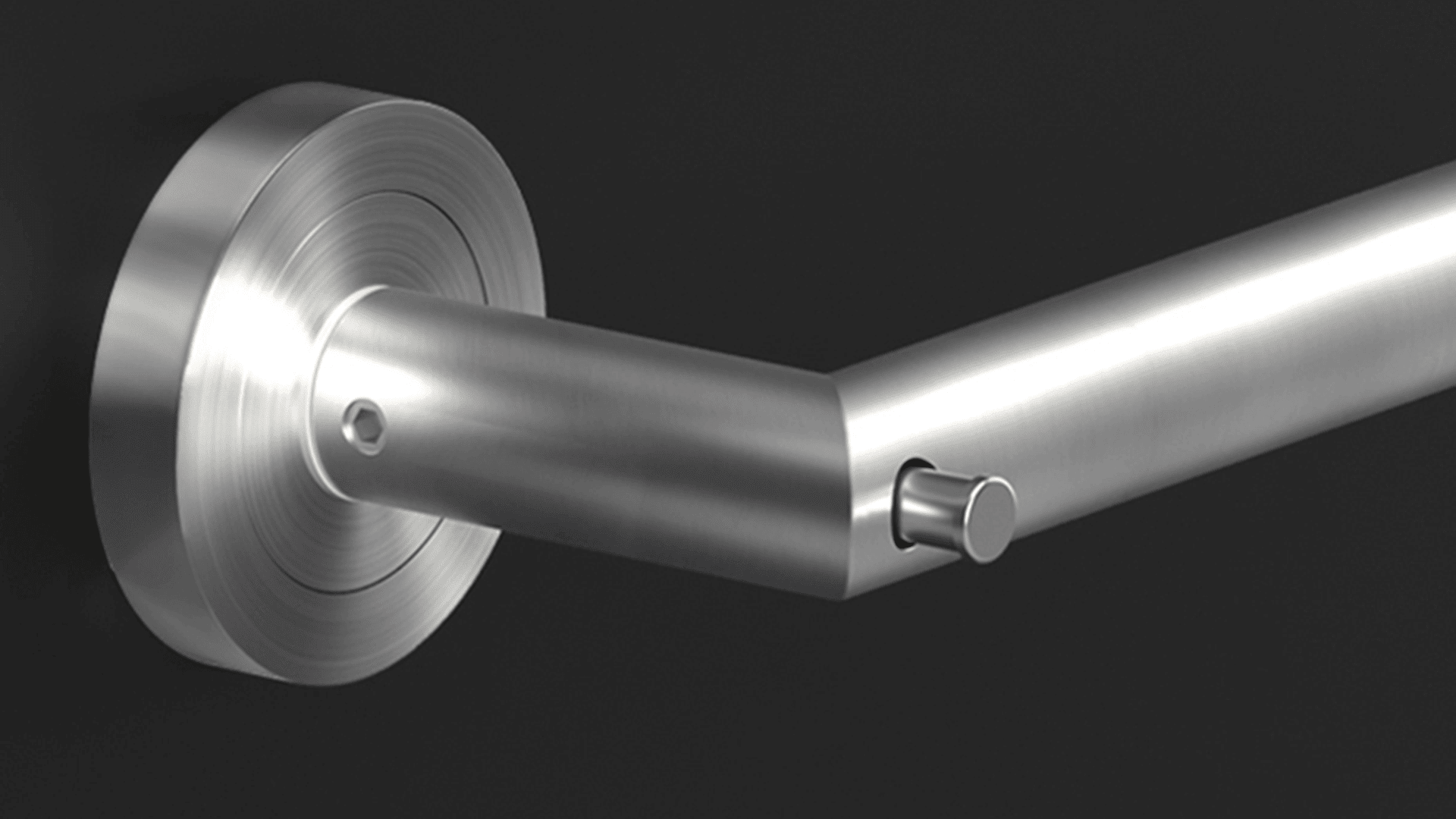 Gros plan d'un support mural moderne en acier inoxydable au design cylindrique, sur un fond sombre. Le luminaire présente une finition en métal brossé et des lignes épurées.