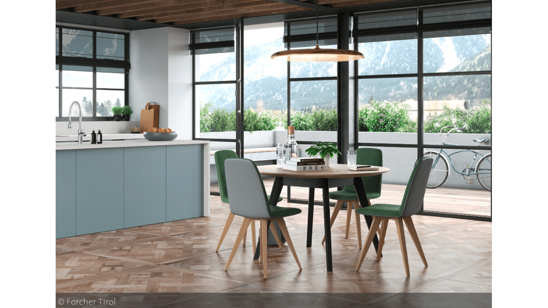 Salle à manger moderne avec une table ronde, quatre chaises vertes et une grande fenêtre donnant sur les montagnes. Cuisine avec armoires bleues sur la gauche ; patio avec plantes et vélo à l'extérieur. Intérieur lumineux, spacieux et contemporain.