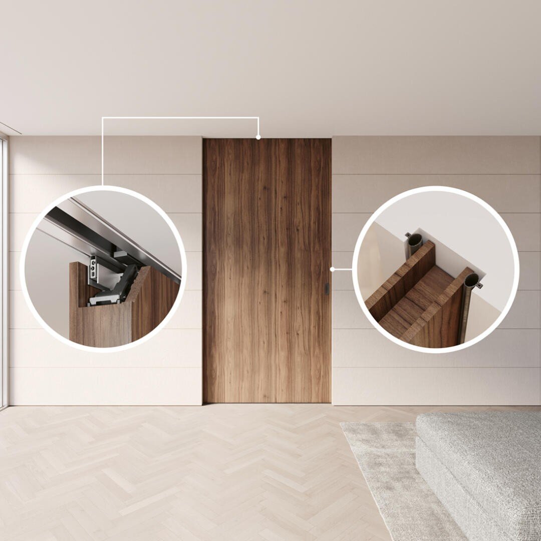 Une porte coulissante en bois moderne est présentée dans une pièce minimaliste. Deux inserts circulaires soulignent le mécanisme supérieur du rail de la porte et la fixation des ferrures coulissantes sur la porte.