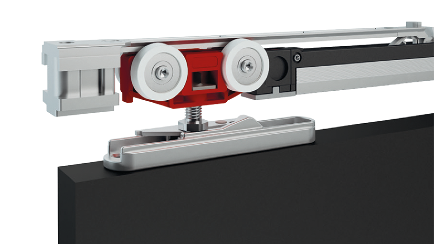 Gros plan d'un système de quincaillerie de porte coulissante avec rail métallique, mécanisme à rouleaux rouge et blanc et support de montage fixé au bord supérieur d'un panneau de porte noir.