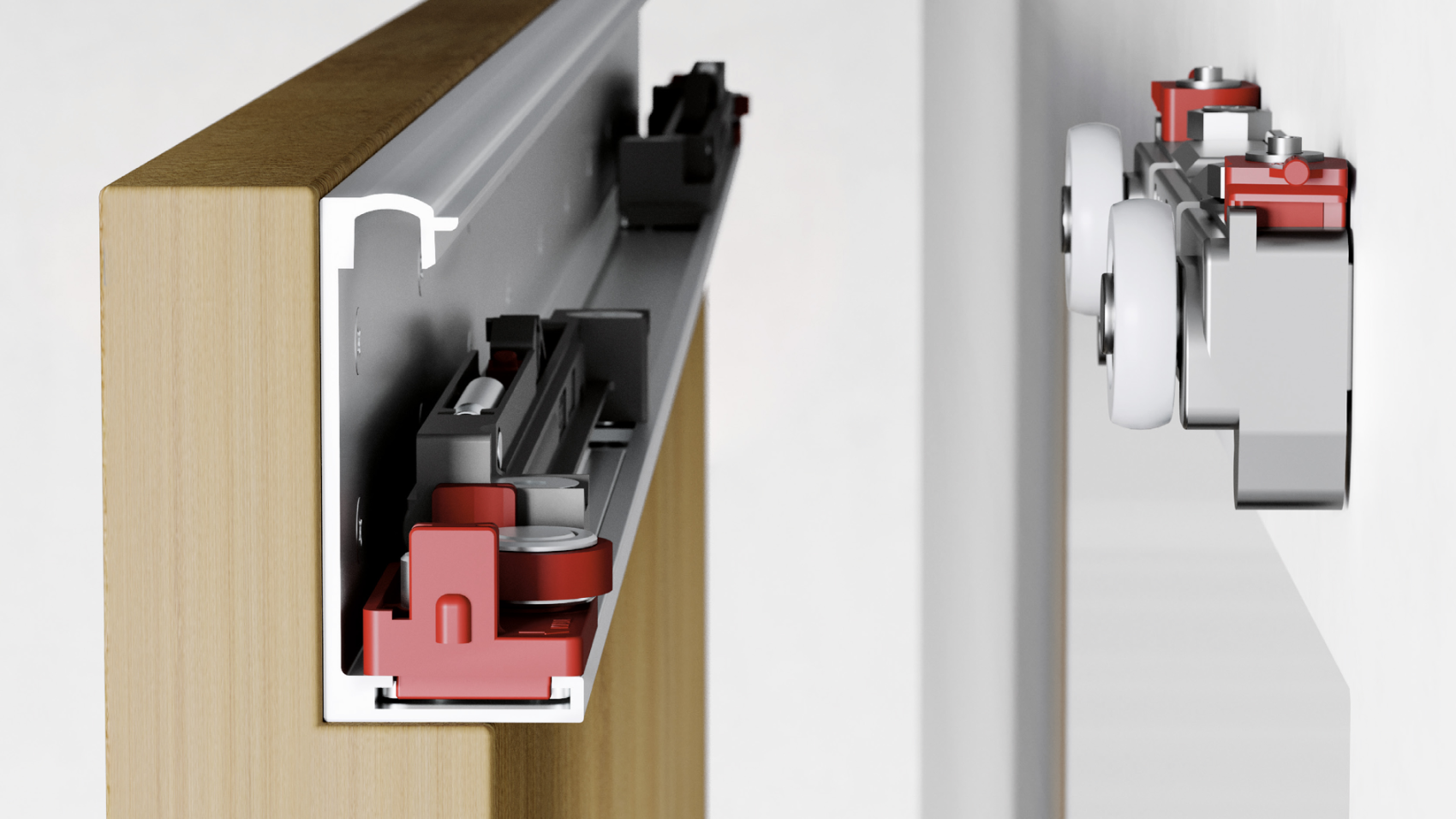 Gros plan d'un système de rail de porte coulissante avec des composants exposés, montrant des rouleaux, des rails métalliques et des pièces en plastique rouge et noir fixées à une porte en bois et à un mur.